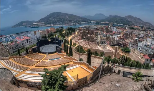  ??  ?? Cartagena’s modern theatre and its Roman equivalent, crowned by the city’s ruined cathedral, shelled in the Spanish Civil War