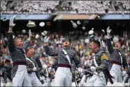  ?? (AP/Eduardo Munoz Alvarez) ?? U.S. Military Academy cadets celebrate Saturday at the end of their graduation ceremony at Michie Stadium in West Point, N.Y.
