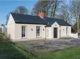  ??  ?? Behind the dainty cottage is a large extension. Left, the open-plan kitchen, living and dining area