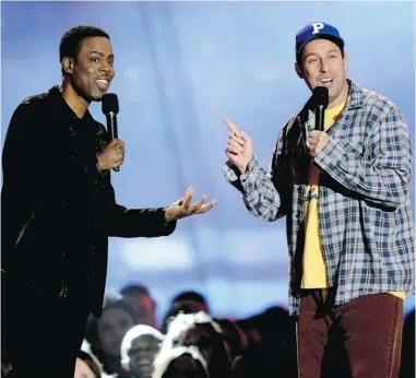  ?? PHOTOS: KEVORK DJANSEZIAN/ GETTY IMAGES ?? Actors Chris Rock, left, and Adam Sandler take the stage at the 2013 MTV Movie Awards Sunday in Culver City, Calif.