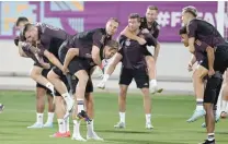  ?? — AFP ?? Germany goalkeeper Manuel Neuer (C-L) and forward Niclas Fuellkrug (C-R) take part in a training session at Al Shamal Stadium.