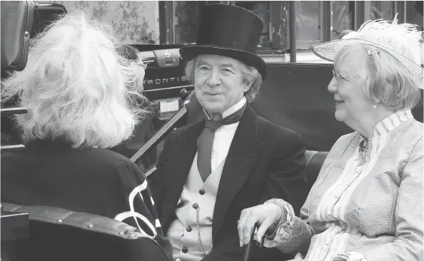  ?? WAYNE LOWRIE / POSTMEDIA NEWS ?? Brian and Renee Porter as Sir John A. Macdonald and Lady Agnes on their way to the Brockville Railway Tunnel opening in August.