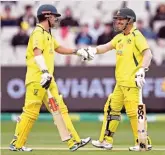  ?? (AFP) ?? Australia's Travis Head (L) and David Warner scored centuries in their third ODI against England at the MCG on Tuesday