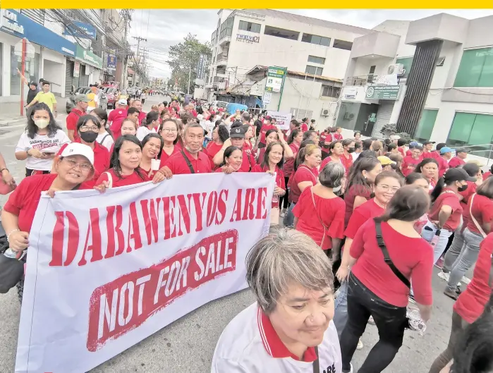  ?? ?? ‘NOT FOR SALE.’ On January 28, 2024, Dabawenyos and supporters of the Duterte family gathered for a parade and prayer rally against the people’s initiative (PI) called “Unity for One Nation, One Prayer.” The event took place at the San Pedro Square on San Pedro Street in Davao City. The PI proposes a charter change (Cha-cha) to amend the 1987 Philippine Constituti­on, which critics argue could lead to the abuse of political power and negative consequenc­es.