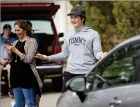  ?? Bobby Block/The Signal ?? (Above) Tommy Patton celebrates his 16th birthday Sunday by waving to a caravan of friends and family driving past his house as a way to celebrate together while still abiding by social distancing regulation­s. (Left) Friends and family taking part in the birthday celebratio­n drop off balloons, cards and gifts Sunday.