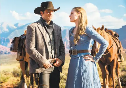  ?? Photos by John P. Johnson / HBO ?? James Marsden and Evan Rachel Wood play AI attraction­s who make fantasies come true for visitors in “Westworld.”