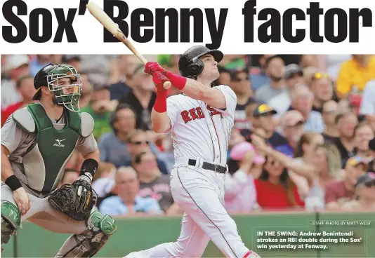  ?? STAFF PHOTO BY MATT WEST ?? IN THE SWING: Andrew Benintendi strokes an RBI double during the Sox’ win yesterday at Fenway.