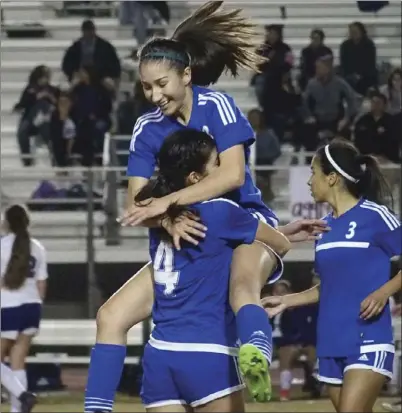  ??  ?? Central Union High’s Dayleth Palacios jumps into teammate Arely Pacheco following the Spartans’ 1-0 win over cross-town rival Southwest High on Thursday night. Palacios had the lone goal of the game off a Pacheco assist. KARINA LOPEZ PHOTOS