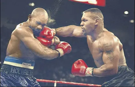 ?? GETTY IMAGES ?? Mike Tyson (right) retired from profession­al boxing in 2005, having won 50 of his 58 fights.