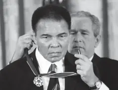  ?? Associated Press ?? ■ President Bush presents the Presidenti­al Medal of Freedom to boxer Muhammad Ali in this 2005 file photo taken in the East Room of the White House.