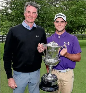  ??  ?? Charlie Smail celebrates his NZ amateur men’s golf title win with father David Smail.