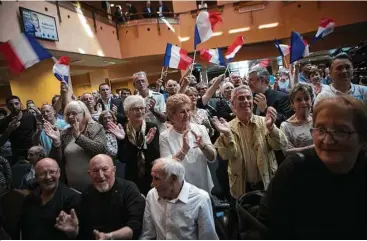  ?? New York Times file photos ?? Supporters of Marine Le Pen’s National Front party meet in Ajaccio on Corsica. France’s presidenti­al election is the biggest test yet of how much Donald Trump’s brand of nationalis­m can sway voters elsewhere.