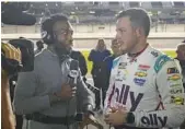  ?? JOHN RAOUX/AP ?? Fox Sports’ Josh Sims, left, interviews driver Alex Bowman on Feb. 15 at Daytona Internatio­nal Speedway.