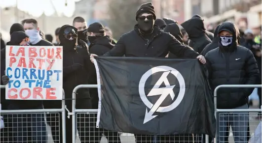  ??  ?? Spreading hatred: National Action members demonstrat­ing in Bolton in 2016, a month before the group was proscribed