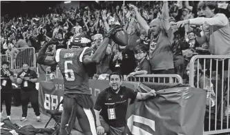  ?? Ronald Cortes/getty Images ?? Fred Brown’s touchdown gave fans something to celebrate in the Brahmas’ opener on Feb. 19 at the Alamodome. The crowd of 24, 245 doubled the next-highest total for the upstart league.