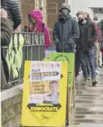  ??  ?? 0 Voters queue at a polling station in Edinburgh