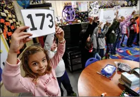  ?? (River Valley Democrat-Gazette/Hank Layton) ?? Emery Stark (left) and other second-graders learn math Friday in Alison Gleason’s classroom at Fairview Elementary School.