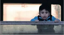  ??  ?? IN TRANSIT: A migrant boy awaits safety in this picture, as the Valletta summit goes on in Italy, offering a chance for change, if the EU allows human rights to take a front seat in the migration debate, says the writer.