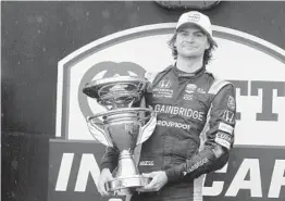  ?? DARRON CUMMINGS/AP ?? Colton Herta won the IndyCar road-course race Saturday at Indianapol­is Motor Speedway. Herta said the victory ahead of the Indy 500 was “nice for momentum.”