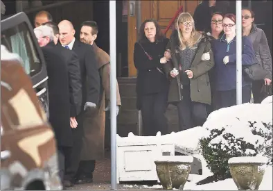 ?? Brian A. Pounds / Hearst Connecticu­t Media ?? Family members of homicide victim Christine Holloway, of Ansonia, follow behind the casket following funeral services at St. Andrew Catholic Church on Anton Street in Bridgeport on Wednesday.