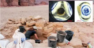  ?? (Courtesy Central Timna Valley Project) ?? A BURIAL MOUND in the Timna Valley held glass beads (inset) next to the remains of a pregnant woman.