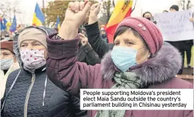  ??  ?? People supporting Moldova’s president elect Maia Sandu outside the country’s parliament building in Chisinau yesterday