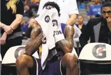  ?? Ron Jenkins / Associated Press ?? Los Angeles guard Louis Williams can’t bear to watch the Lakers’ historical­ly bad 49-point loss in Dallas.