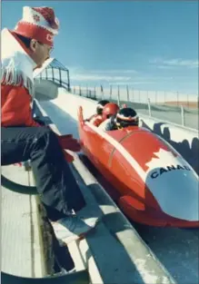  ?? CANADIAN PRESS FILE PHOTO ?? Canadian coach Franz Schachner sits on the rail watching the Canadian four-man team, Canada 1, compete in the men’s World Cup bobsled event in Calgary on Feb. 24, 1988.