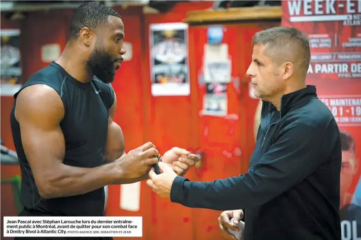  ?? PHOTO AGENCE QMI, SEBASTIEN ST-JEAN ?? Jean Pascal avec Stéphan Larouche lors du dernier entraîneme­nt public à Montréal, avant de quitter pour son combat face à Dmitry Bivol à Atlantic City.