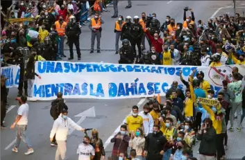  ?? Fran Santiago/Getty Images ?? Fans in Cadiz, Spain, make their voices heard about the new European Super League before a match between Cadiz CF and Real Madrid, one of two teams still officially part of the league.