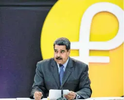  ??  ?? MADURO at the event launching the new cryptocurr­ency, the Petro, in Caracas on February 20. Dealing in crypto currency will help Venezuela to evade U.S. sanctions. It will also allow Venezuela to contract new debt.