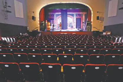  ?? Scott Strazzante / The Chronicle ?? Paul Nathan (left) and John Anaya prepare for the soft opening with “Devil and the Deck” at Great Star Theater in San Francisco’s Chinatown. The theater formally opens on June 18.