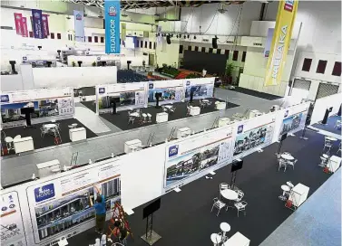  ?? — Bernama ?? All set: A worker adding the finishing touches to an exhibit at the home expo at the Putra World Trade Centre in Kuala Lumpur.