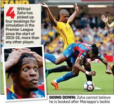  ??  ?? GOING DOWN: Zaha cannot believe he is booked after Mariappa’s tackle