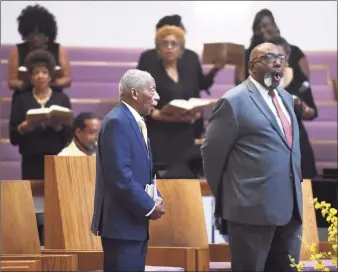  ?? Tyler Sizemore / Hearst Connecticu­t Media ?? The Rev. Dr. Robert Perry, left, sings beside the Rev. Carleton Giles at Perry’s Retirement Celebratio­n Service at Union Baptist Church in Stamford on Sunday. Over Perry’s 48-year tenure, the church moved from Adams Avenue to Newfield Avenue, underwent and completed a multimilli­on-dollar constructi­on project, and later burned its mortgage.