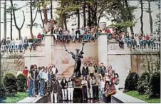  ?? GEORGE BOLSTER PHOTO ?? In September 1975, the Saratoga Springs High School Class of ‘76 posed for a yearbook picture at the Spirit of Life statue in Congress Park. The photo was taken by George Bolster. Alumni recreated the scene during their recent 40th class reunion.