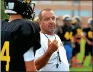  ?? DIGITAL FIRST MEDIA FILE PHOTO ?? Archbishop Wood head coach Steve Devlin talks to his players during the team’s practice in August leading up to the 2016 season. Devlin was hired as the next defensive coordinato­r for the Ursinus College football team earlier this week.