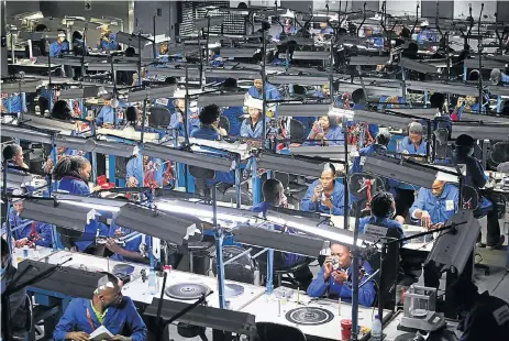  ?? /Bloomberg ?? Eyeing new strategies: Employees prepare and polish diamonds at workstatio­ns at the Shrenuj Botswana sightholde­r office in Gaborone, Botswana. Although in 2015 mining consisted of 20% of the country’s GDP only – compared with more than half in 1988-89 – it still looms large over the economy.