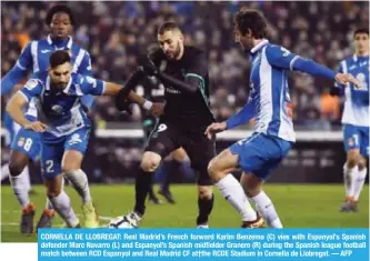  ?? — AFP ?? CORNELLA DE LLOBREGAT: Real Madrid’s French forward Karim Benzema (C) vies with Espanyol’s Spanish defender Marc Navarro (L) and Espanyol’s Spanish midfielder Granero (R) during the Spanish league football match between RCD Espanyol and Real Madrid CF...