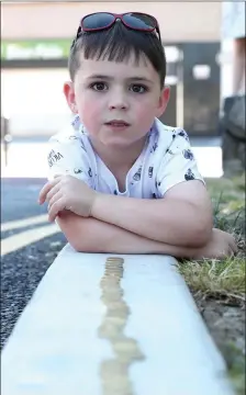  ??  ?? Ethan Scanlon pictured at Sunday’s fundraiser for the Duleek Fair Day where a trail of 50 cent pieces raised funds for the upcoming event.