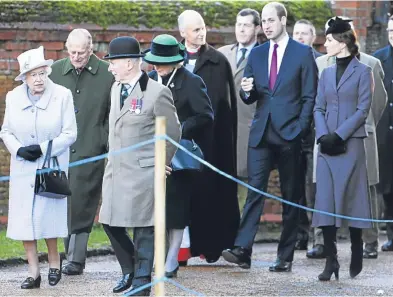  ??  ?? The Queen and duke each placed a wreath at the war memorial dedicated to local men who fought in the First World War. The ceremony was also attended by the Duke and Duchess of Cambridge.