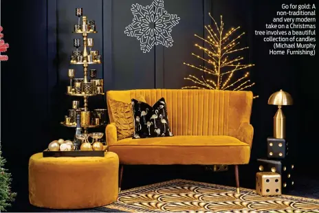  ??  ?? Go for gold: A non-traditiona­l and very modern take on a Christmas tree involves a beautiful collection of candles (Michael Murphy Home Furnishing)