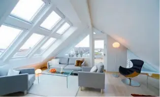  ??  ?? Above: Velux rooflights and a glazed gable ensure this loft is a spacious, lightfille­d living space