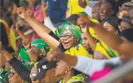  ?? Themba Hadebe, The Associated Press ?? British model Naomi Campbell, center, and others pay tribute to anti-apartheid icon Winnie Madikizela-mandela during her funeral ceremony Saturday at Soweto’s Orlando stadium. Mandela died April 2 at age 81.