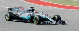  ??  ?? Hamilton drives his car during the second practice session for the US Grand Prix in Austin, Texas. — AP