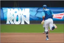  ?? Canadian Press photo ?? Toronto Blue Jays Kendrys Morales rounds the bases after hitting a team record-breaking two-run home run against the Philadelph­ia Phillies during the third inning of an interleagu­e baseball game, Sunday in Toronto. Morales broke the team record for home runs in consecutiv­e games with his seventh straight.