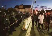  ?? Chris Preovolos / Hearst Newspapers 2020 ?? Protesters stand near the Vallejo Police Department during a protest against the killing of Sean Monterrosa in June 2020.