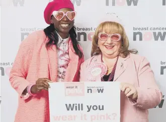  ??  ?? MP Sharon Hodgson poses in pink with former Olympian Donna Fraser to support Breast Cancer Now.