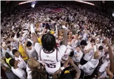  ?? ?? Texas A&M guard Manny Obaseki celebrates with the Texas A&M student section after Saturday’s victory over Alabama in College Station, Texas. LOGAN HANNIGAN-DOWNS — COLLEGE STATION EAGLE VIA AP