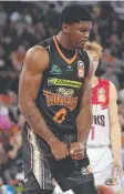  ??  ?? Cameron Oliver of the Taipans reacts after scoring.